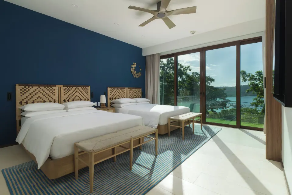 Two-bed penthouse bedroom with bay view at Andaz Peninsula Papagayo Resort, Costa Rica.
