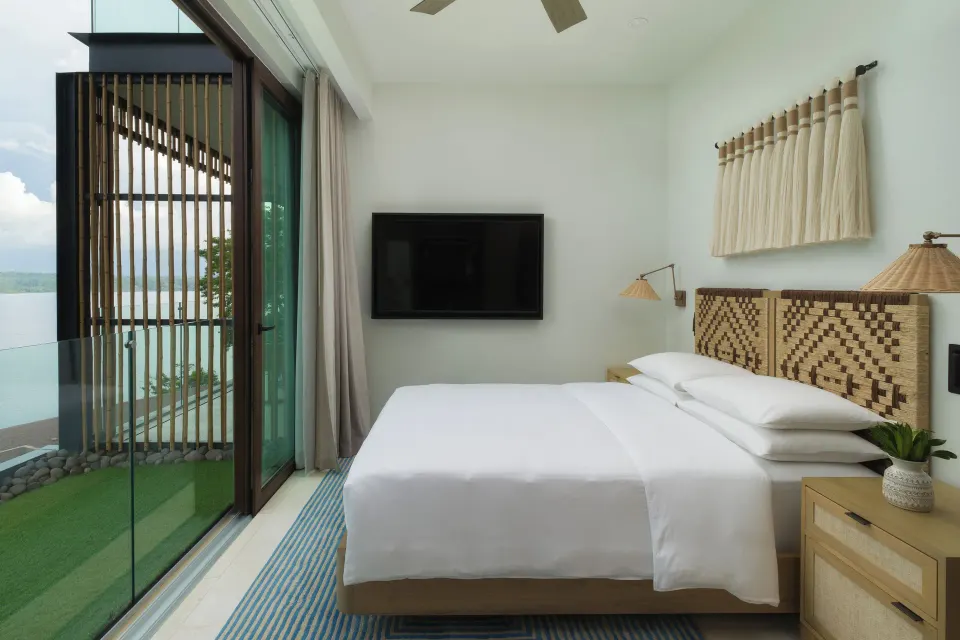 King bedroom with balcony access in the 3 Bedroom Penthouse at Andaz Peninsula Papagayo Resort, Costa Rica.