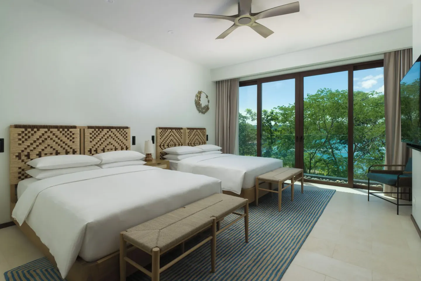 Two double beds in the 3 Bedroom Penthouse at Andaz Peninsula Papagayo Resort, Costa Rica.