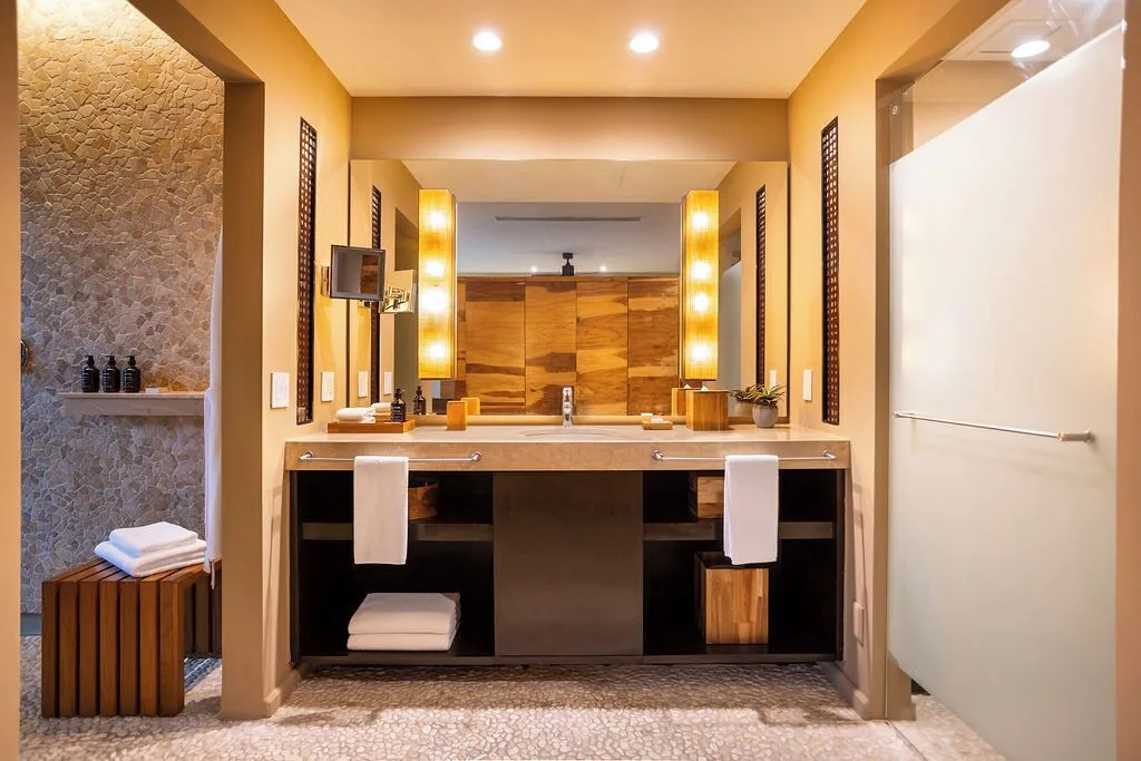 Guest room bathroom vanity and shower at Andaz Peninsula Papagayo Resort, Costa Rica.