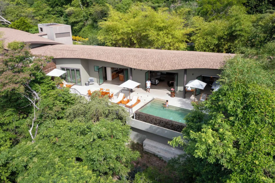 Aerial view of pool suite terrace in the trees at Andaz Peninsula Papagayo Resort, Costa Rica.