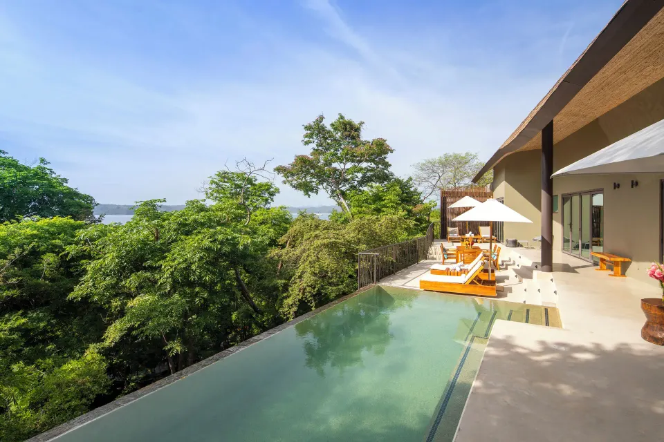 Private pool and terrace overlooking trees at Andaz Peninsula Papagayo Resort, Costa Rica.