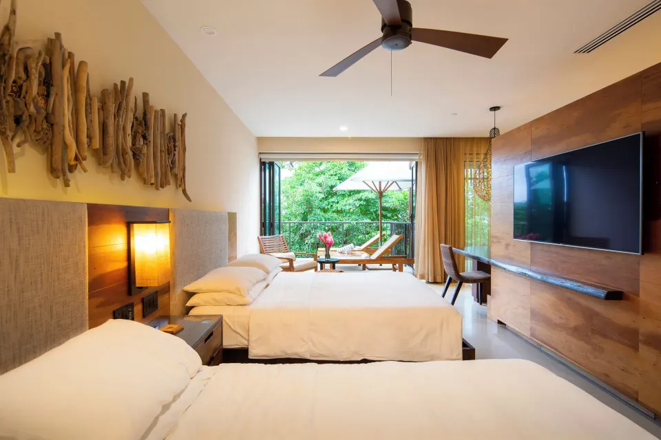 Two-bed guest room with terrace view at Andaz Peninsula Papagayo Resort, Costa Rica.