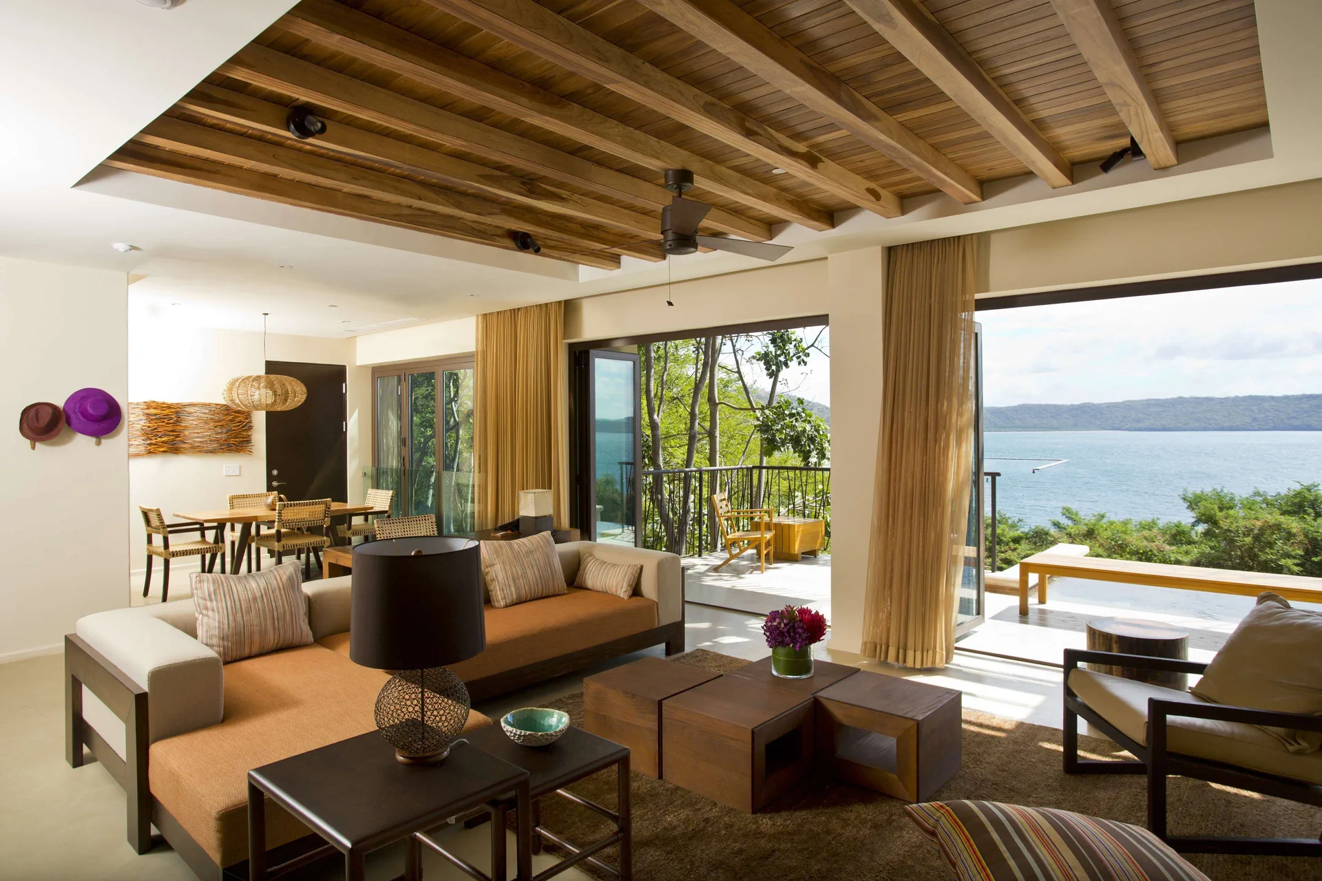 Suite living room with ocean-facing terrace at Andaz Peninsula Papagayo Resort, Costa Rica.