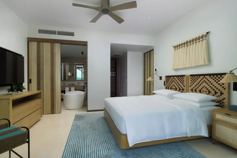 King villa bedroom with open bathroom view at Andaz Peninsula Papagayo Resort, Costa Rica.