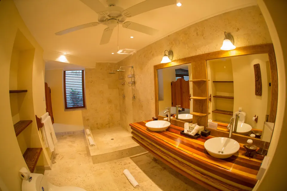 Hillside Deluxe Oceanview bathroom with double vanity and walk-in shower at Anse Chastanet Resort.