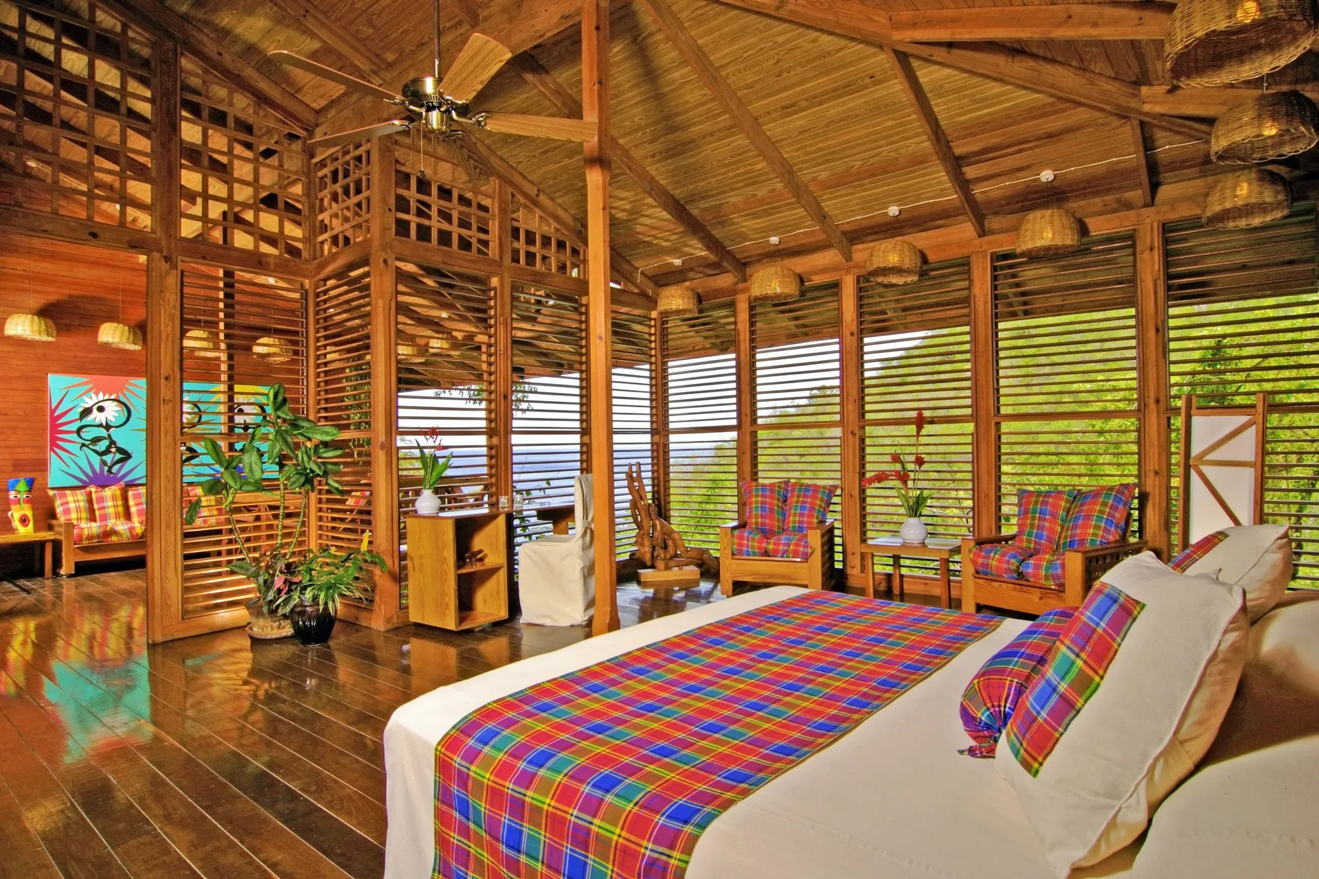 Hillside Deluxe Oceanview room with king bed and wood shutters at Anse Chastanet Resort.