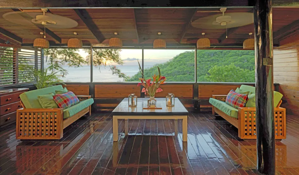 Hillside Deluxe Oceanview sitting room with sofas and sea view at Anse Chastanet Resort.