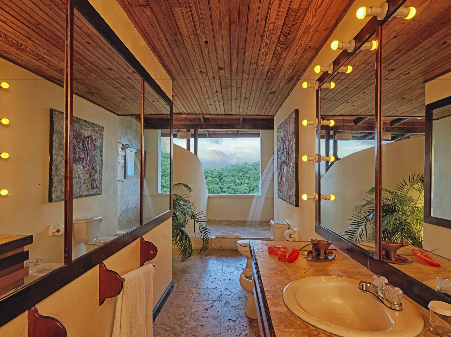 Premium Room bathroom with vanity, mirrors and open view at Anse Chastanet Resort.