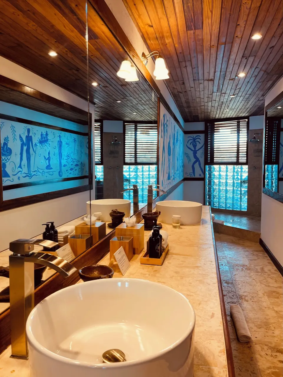 Premium Room bathroom with double sinks and glass-block shower at Anse Chastanet Resort.