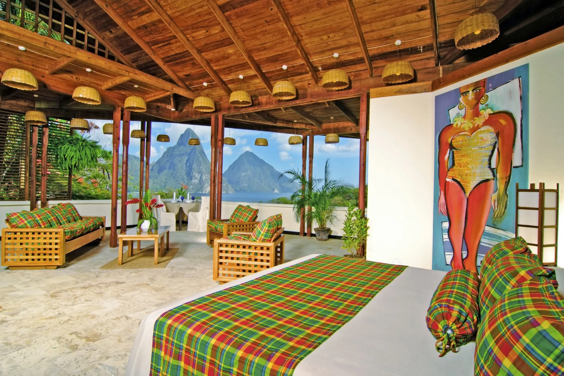 Premium Room with a bed, lounge seating and Piton ocean view at Anse Chastanet Resort.