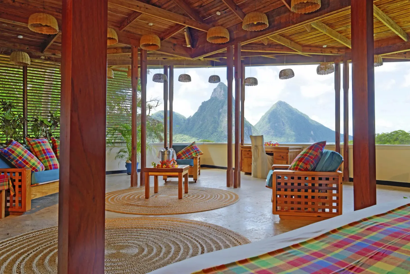 Premium Room with bed edge, sitting area and Piton view at Anse Chastanet Resort.