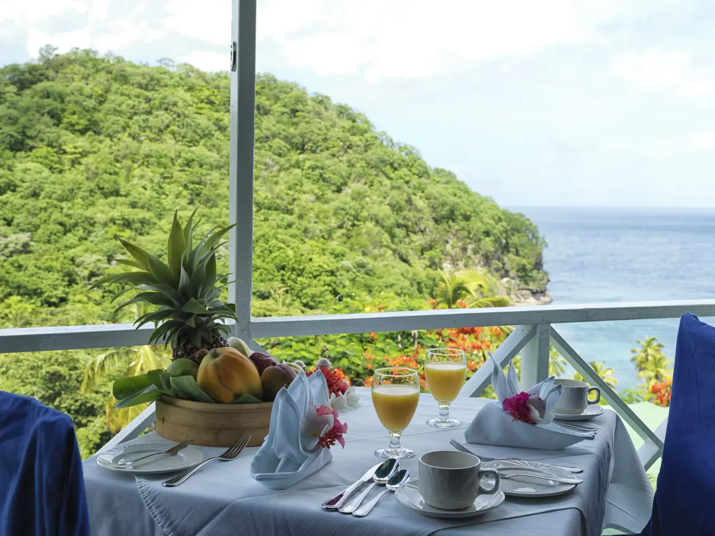Balcony breakfast with ocean and hillside views at Anse Chastanet Resort.