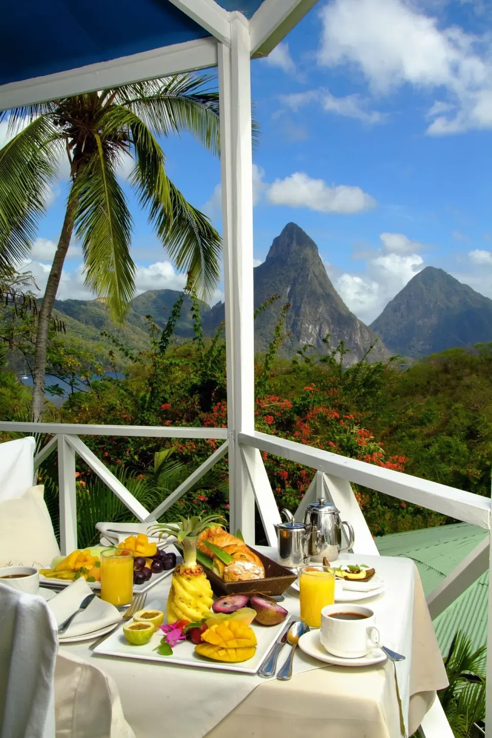 Balcony breakfast with Piton mountain views at Anse Chastanet Resort.