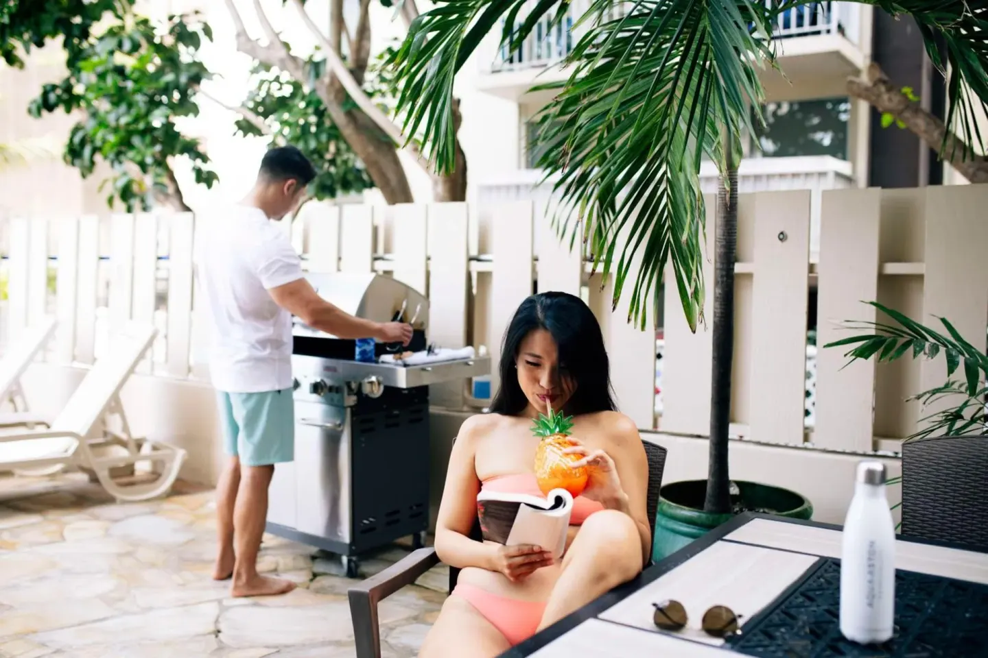 Outdoor patio with lounge seating and grill at Aqua Aloha Surf Waikiki.