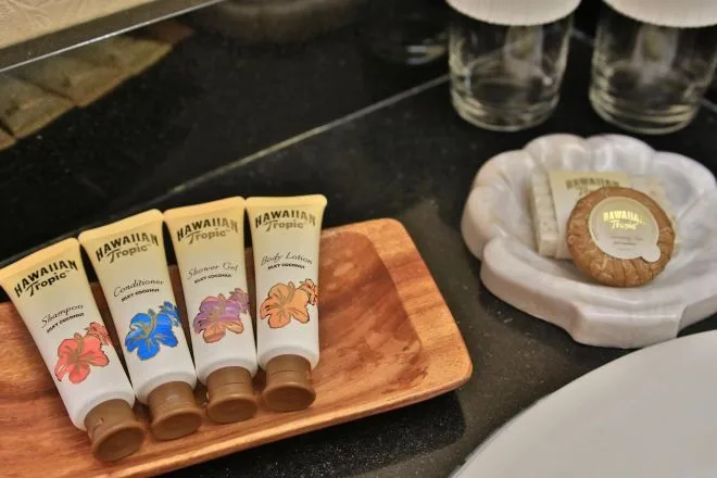 Moderate Room bath toiletries arranged beside the sink at Aqua Aloha Surf Waikiki.