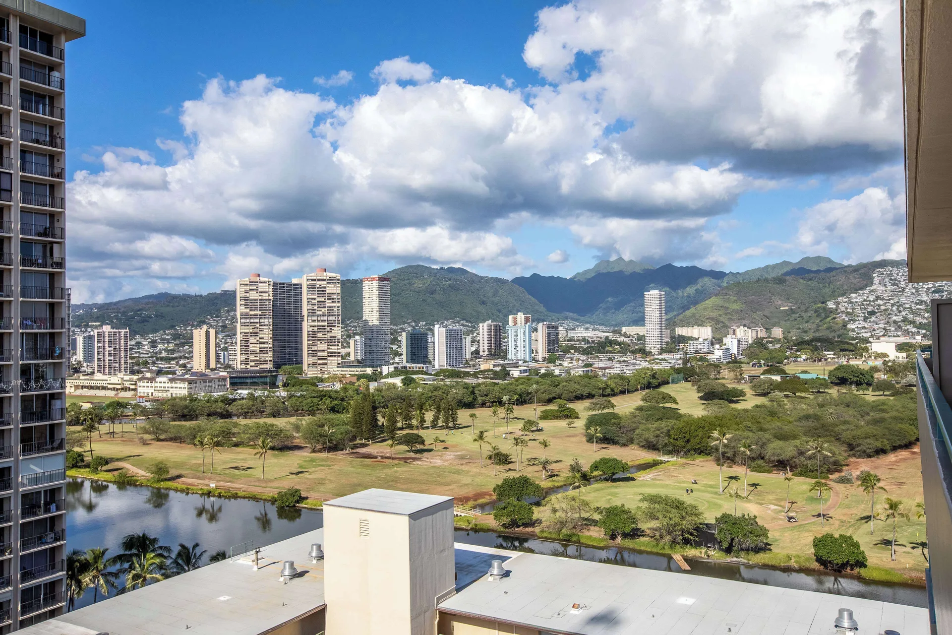 City, park, and mountain view from a suite at Aqua Aloha Surf Waikiki.