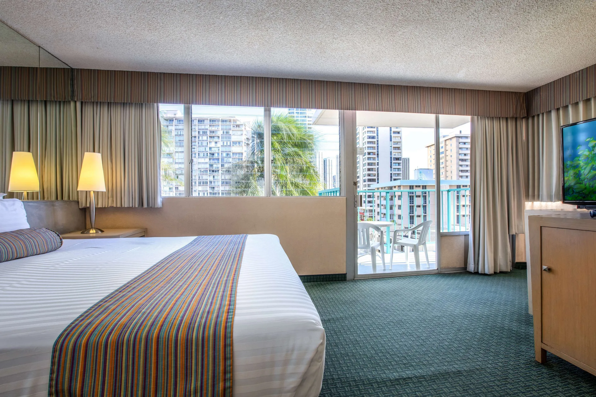 Superior Room with king bed and balcony view at Aqua Aloha Surf Waikiki.