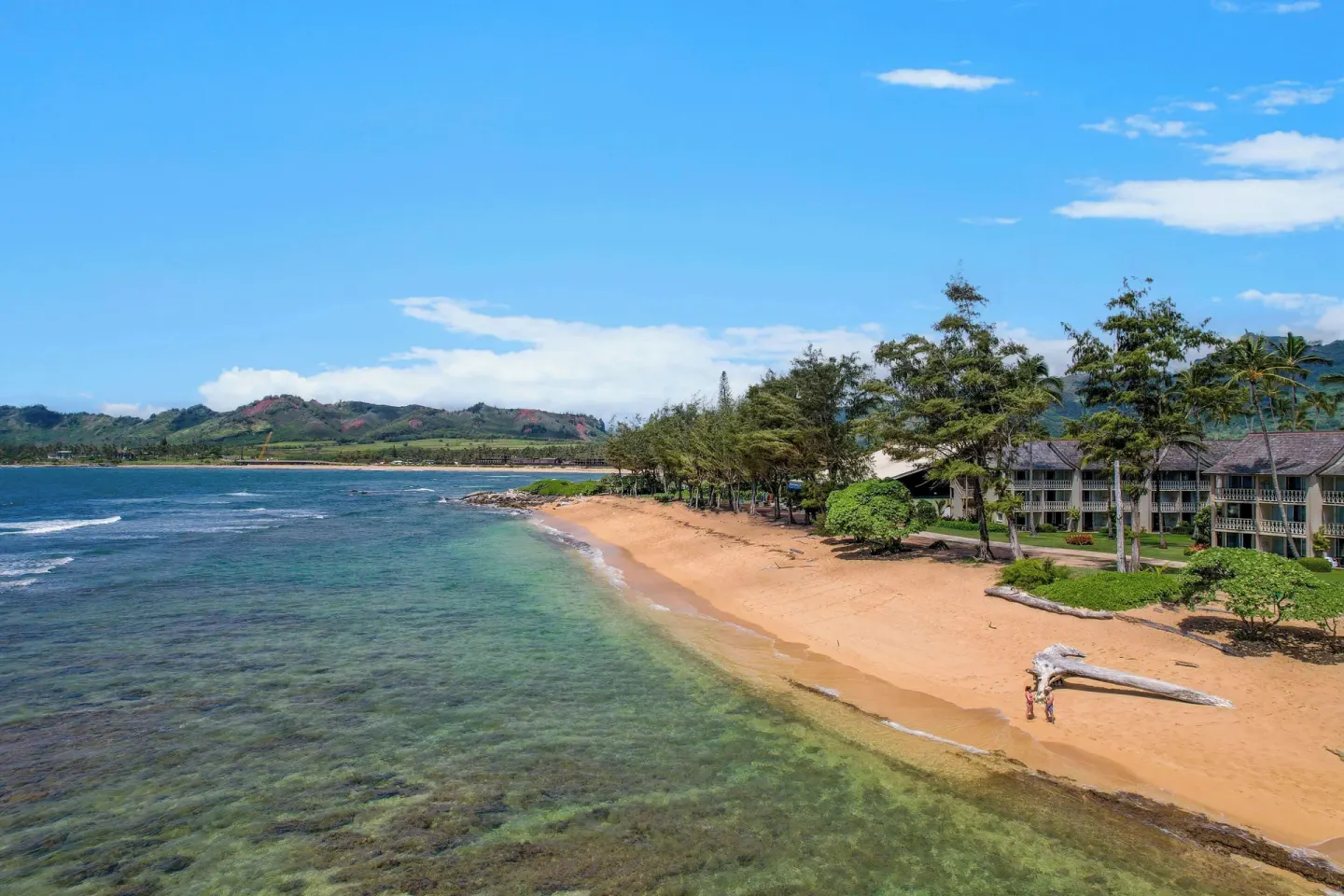Beachfront shoreline and resort buildings at Aston Islander on the Beach.