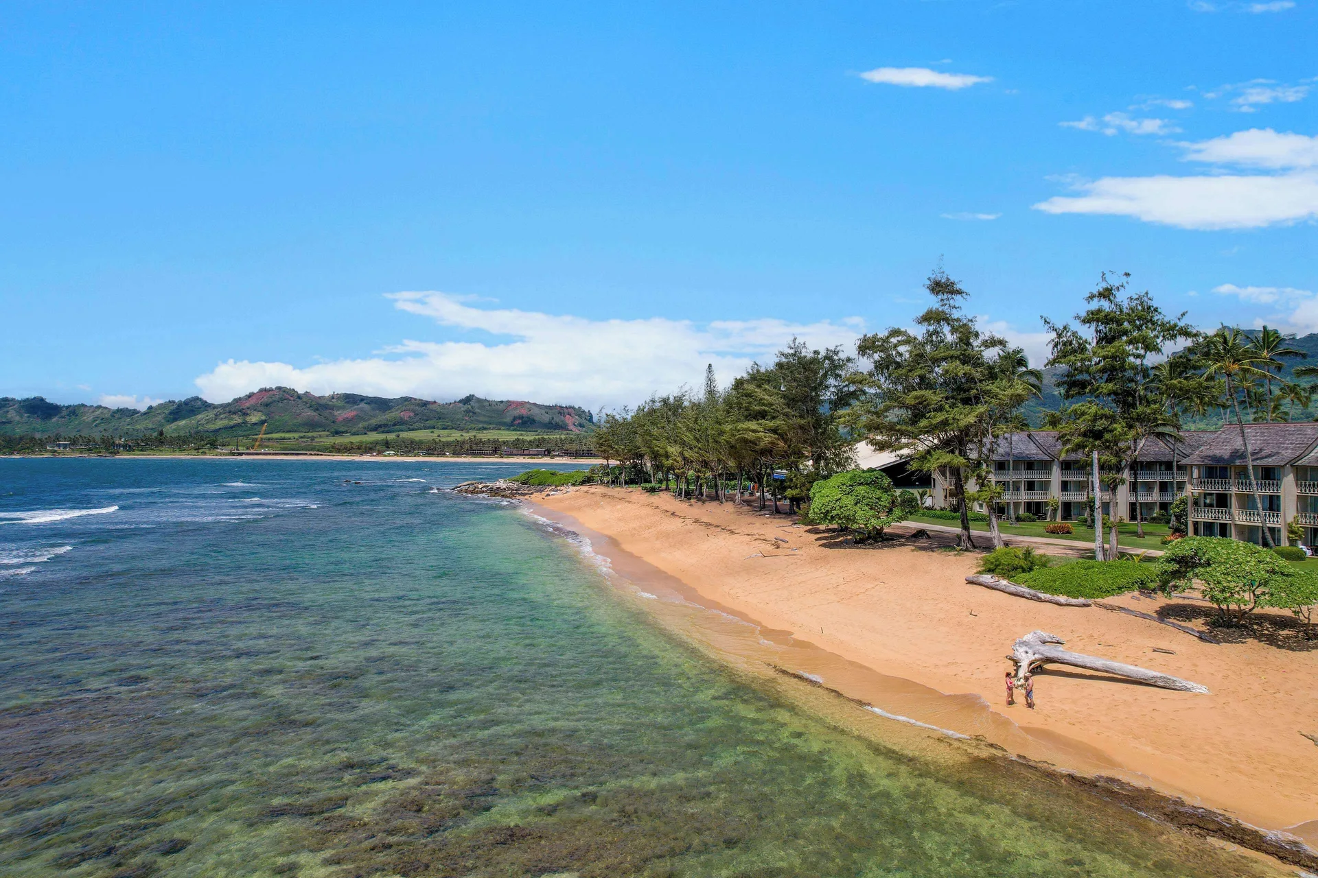 Beachfront shoreline and resort buildings at Aston Islander on the Beach.