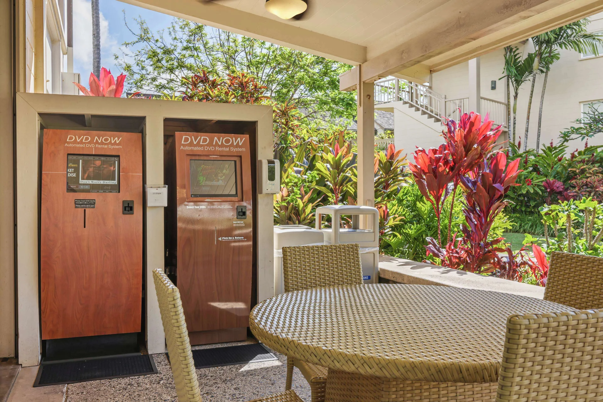Covered outdoor seating with DVD rental kiosks at Aston Islander on the Beach.