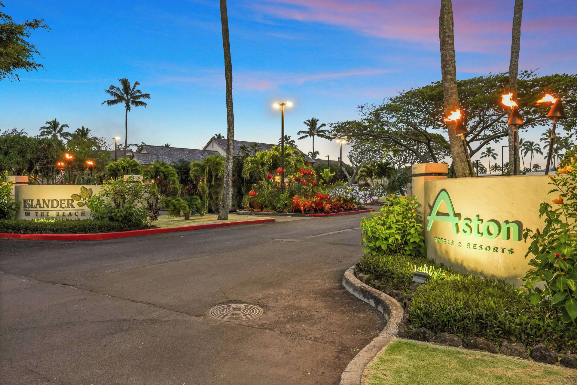 Driveway entrance with illuminated signs at Aston Islander on the Beach.