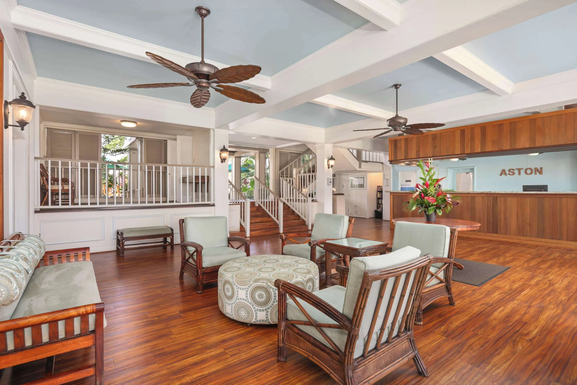 Lobby seating area and front desk at Aston Islander on the Beach.