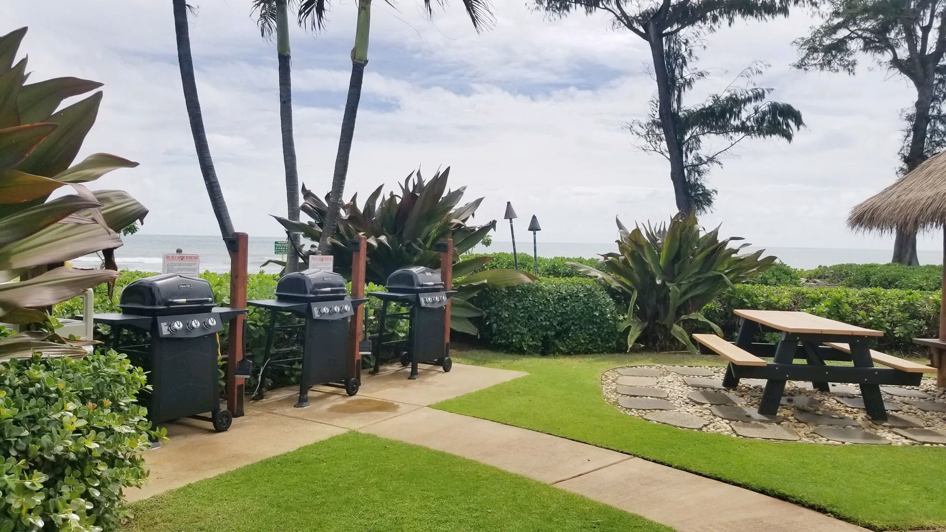 Oceanfront barbecue grills and picnic seating at Aston Islander on the Beach.