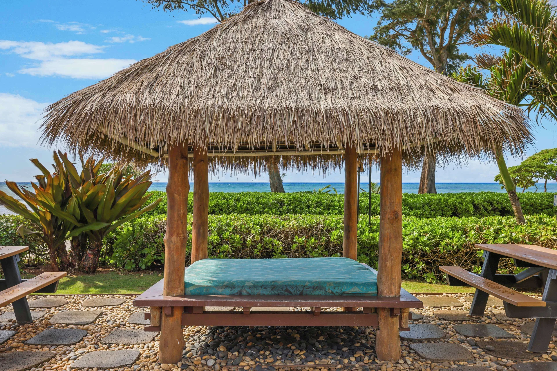 Thatched daybed facing the ocean at Aston Islander on the Beach.