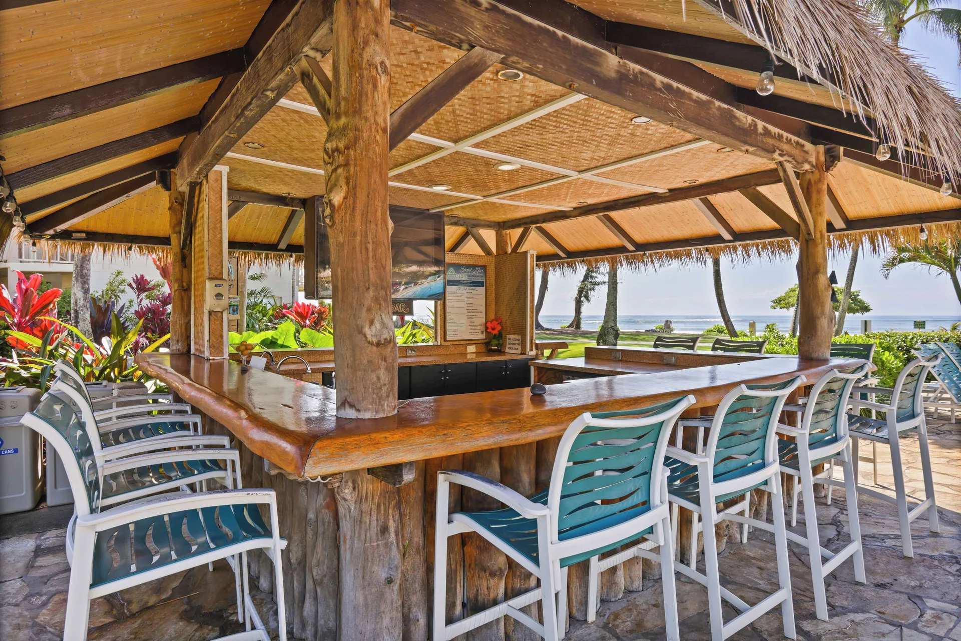 Thatched Pool Bar with ocean views at Aston Islander on the Beach.