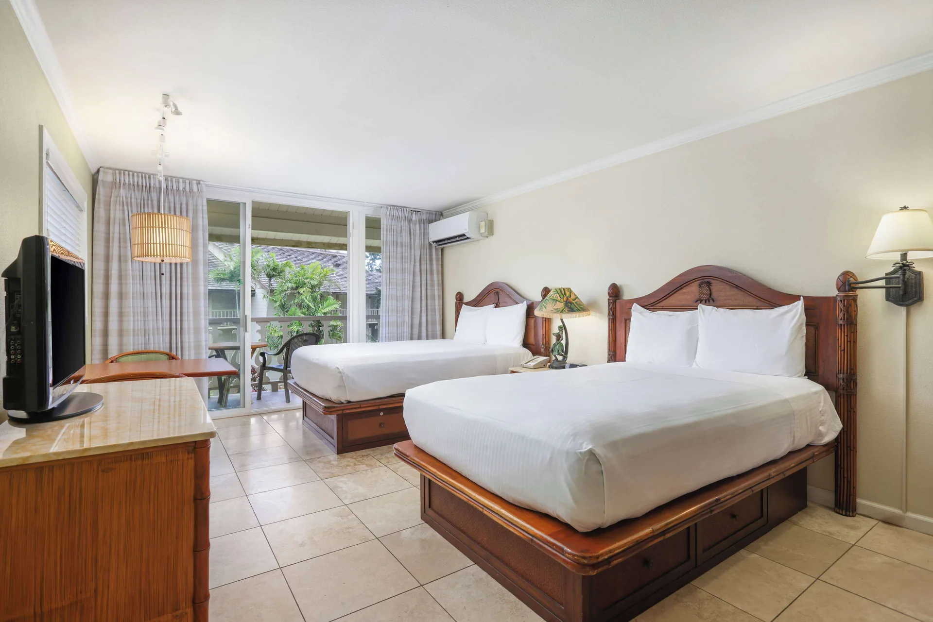 Garden View room with two beds and balcony at Aston Islander on the Beach.