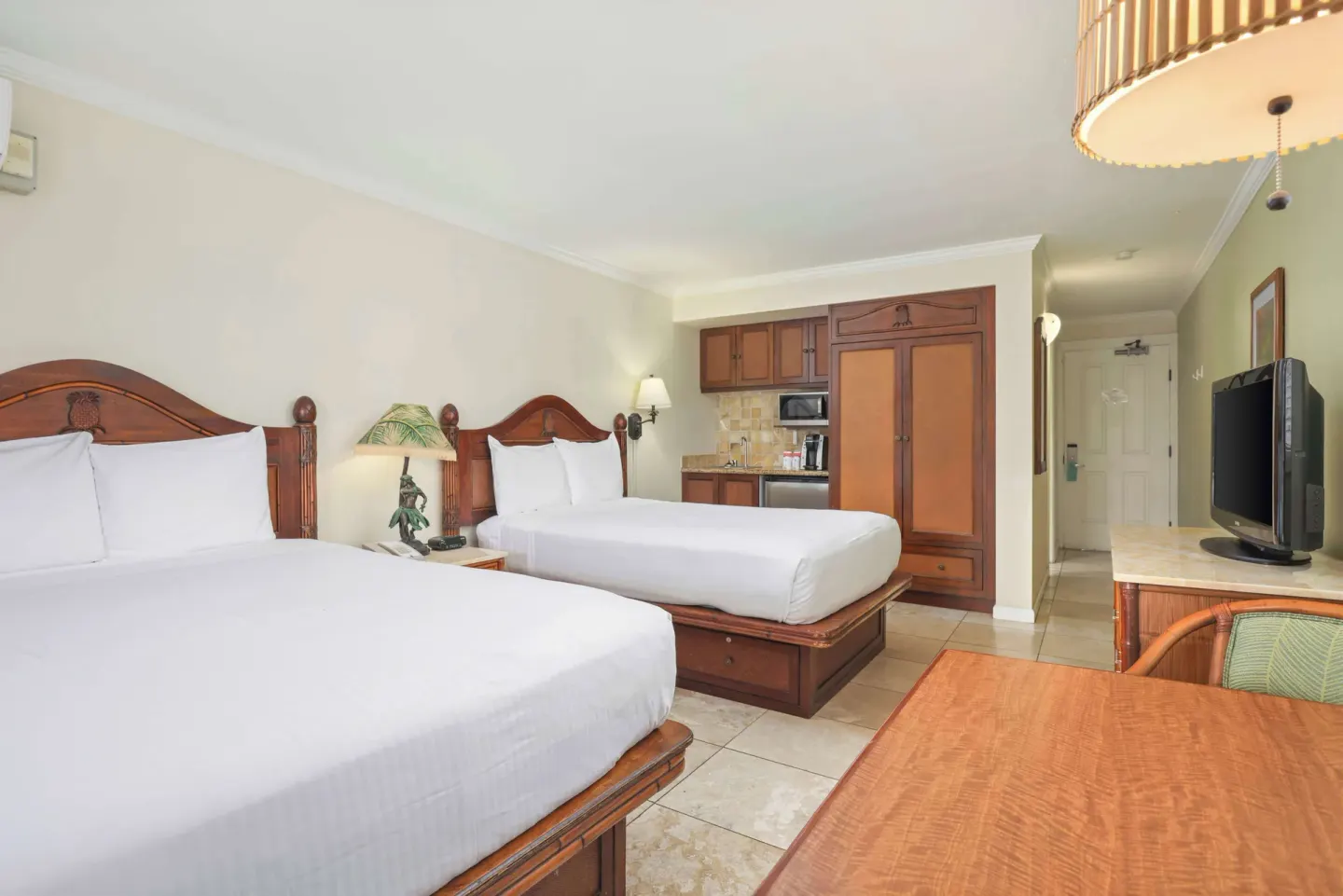 Garden View room with two beds and kitchenette at Aston Islander on the Beach.