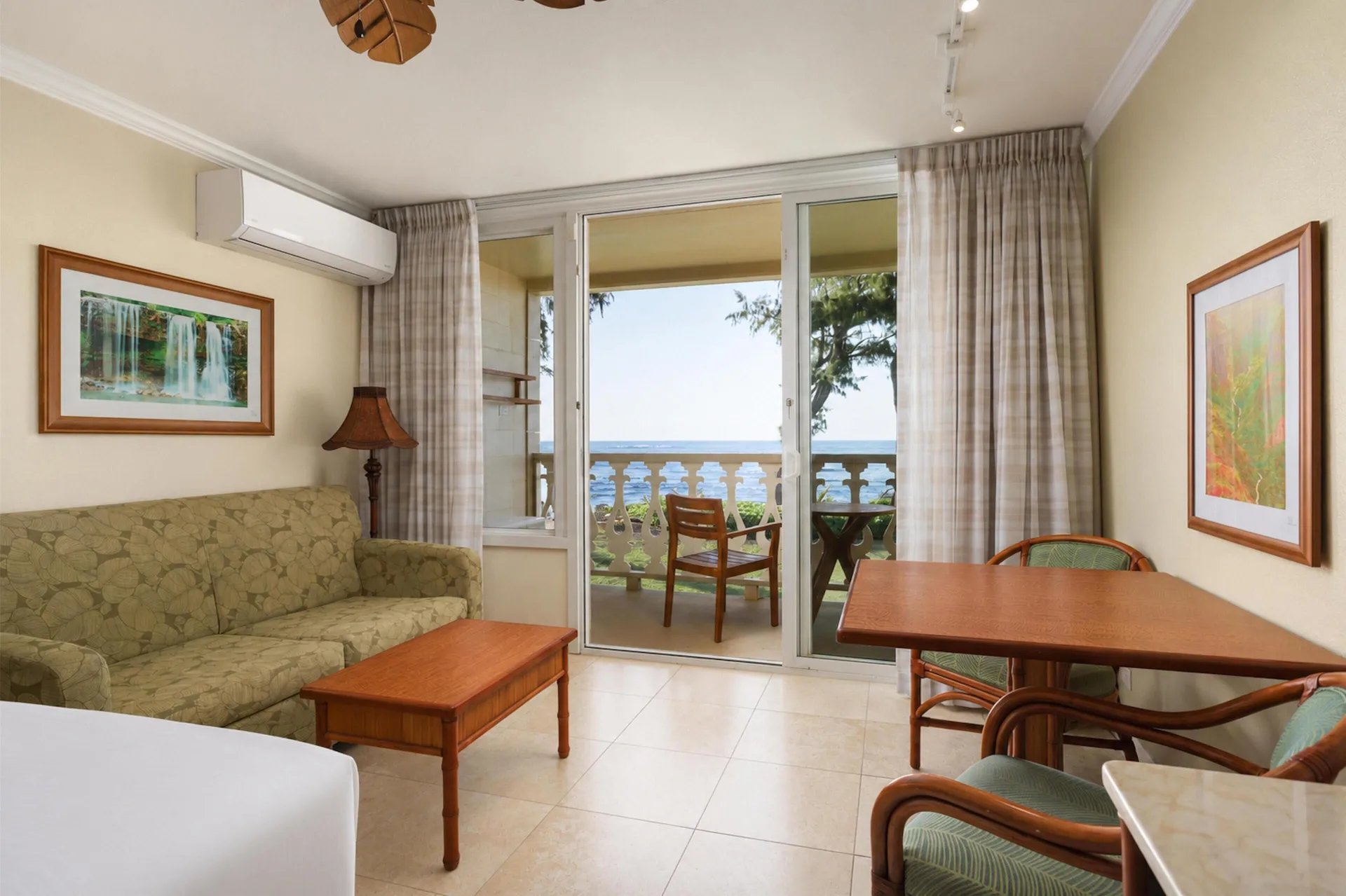 Oceanfront room sitting area and balcony view at Aston Islander on the Beach.