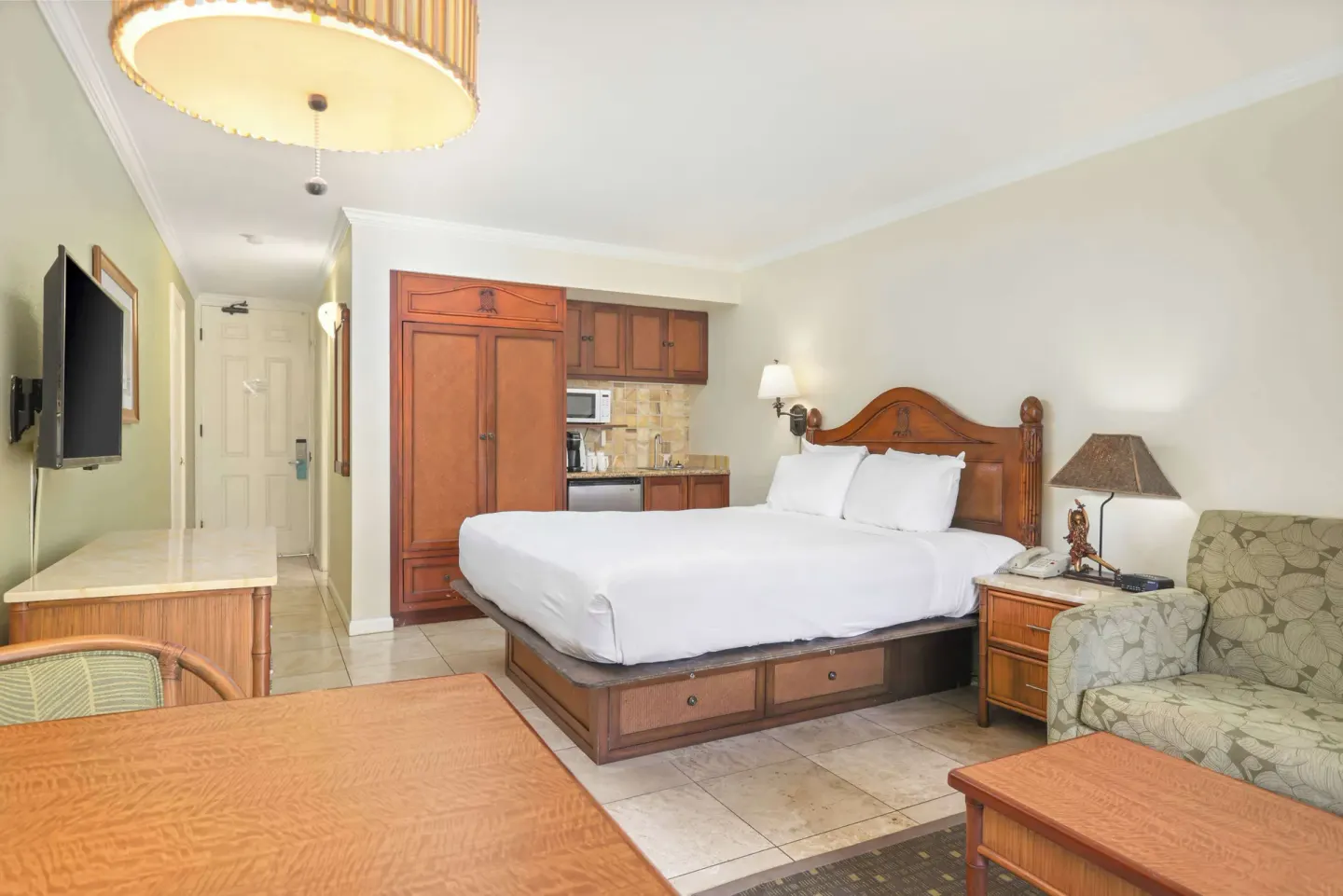 Partial ocean view room with king bed and kitchenette at Aston Islander on the Beach.