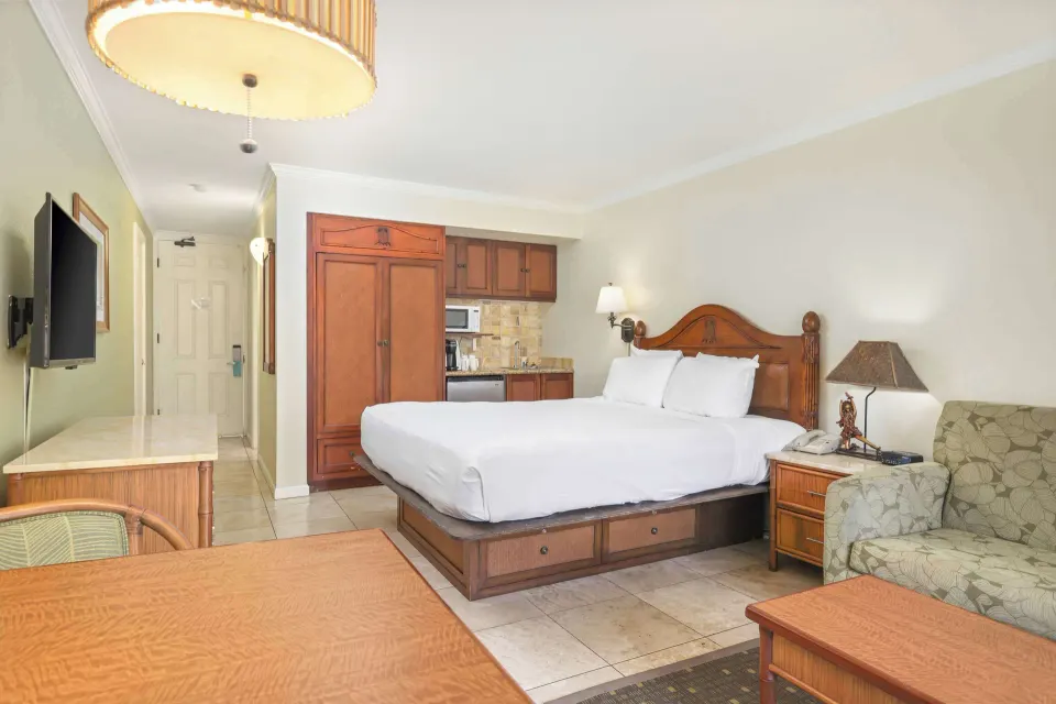 Partial ocean view room with king bed and kitchenette at Aston Islander on the Beach.