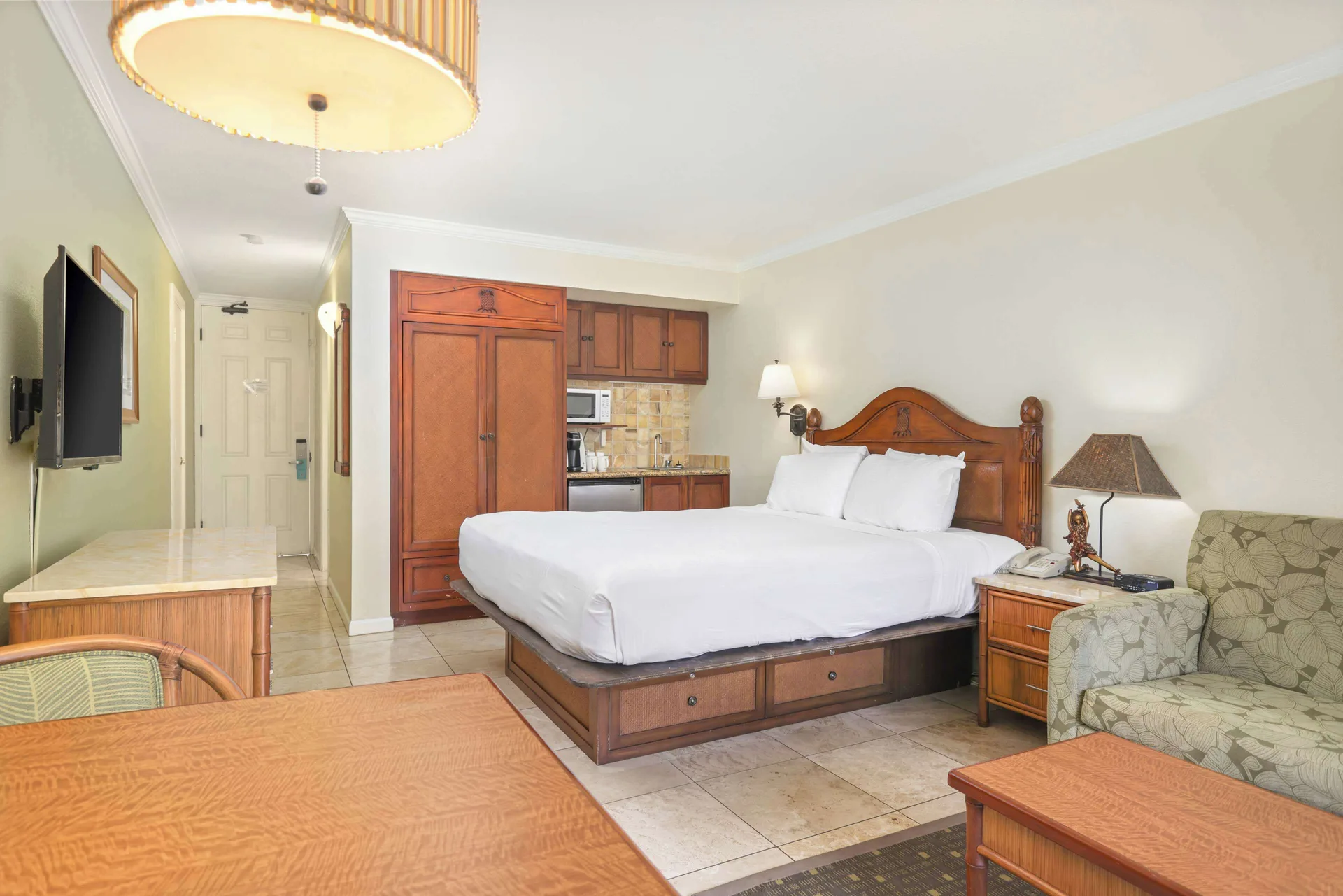 Partial ocean view room with king bed and kitchenette at Aston Islander on the Beach.