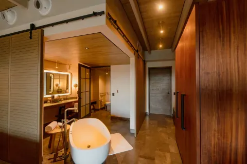 Inspira Junior Suite Ocean Front bathroom and freestanding tub at Atelier Playa Mujeres.