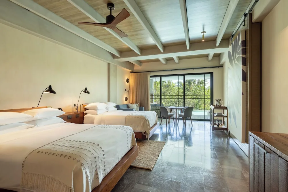 Inspira Junior Suite Swim Out with two beds and balcony at Atelier Playa Mujeres.