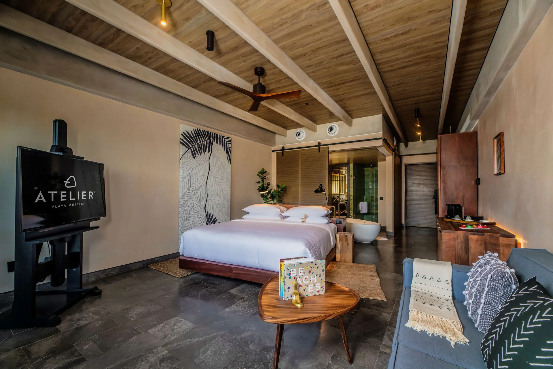 Inspira Junior Suite Swim Out Ocean View with king bed and sofa at Atelier Playa Mujeres.