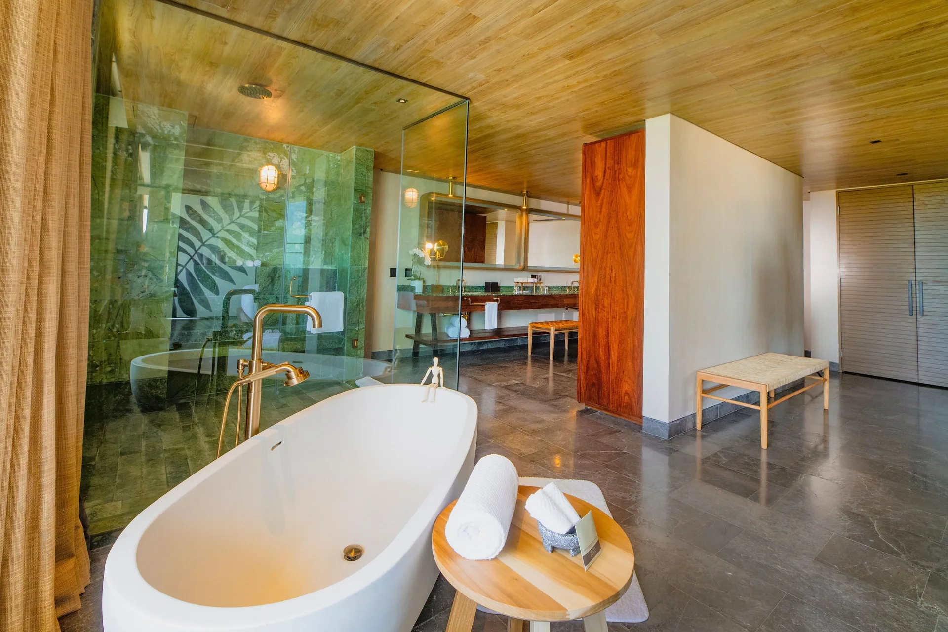 Inspira Master Suite Ocean Front bathroom with freestanding tub at Atelier Playa Mujeres.