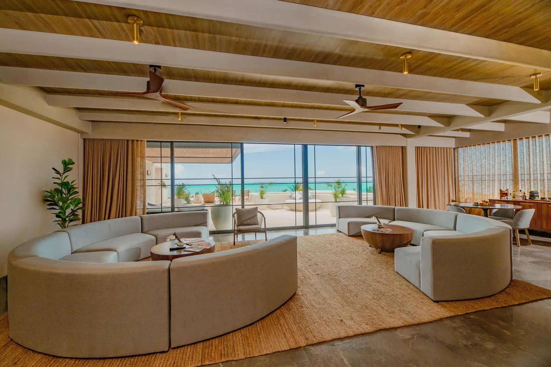Inspira Master Suite Ocean Front living room with sea-facing terrace at Atelier Playa Mujeres.