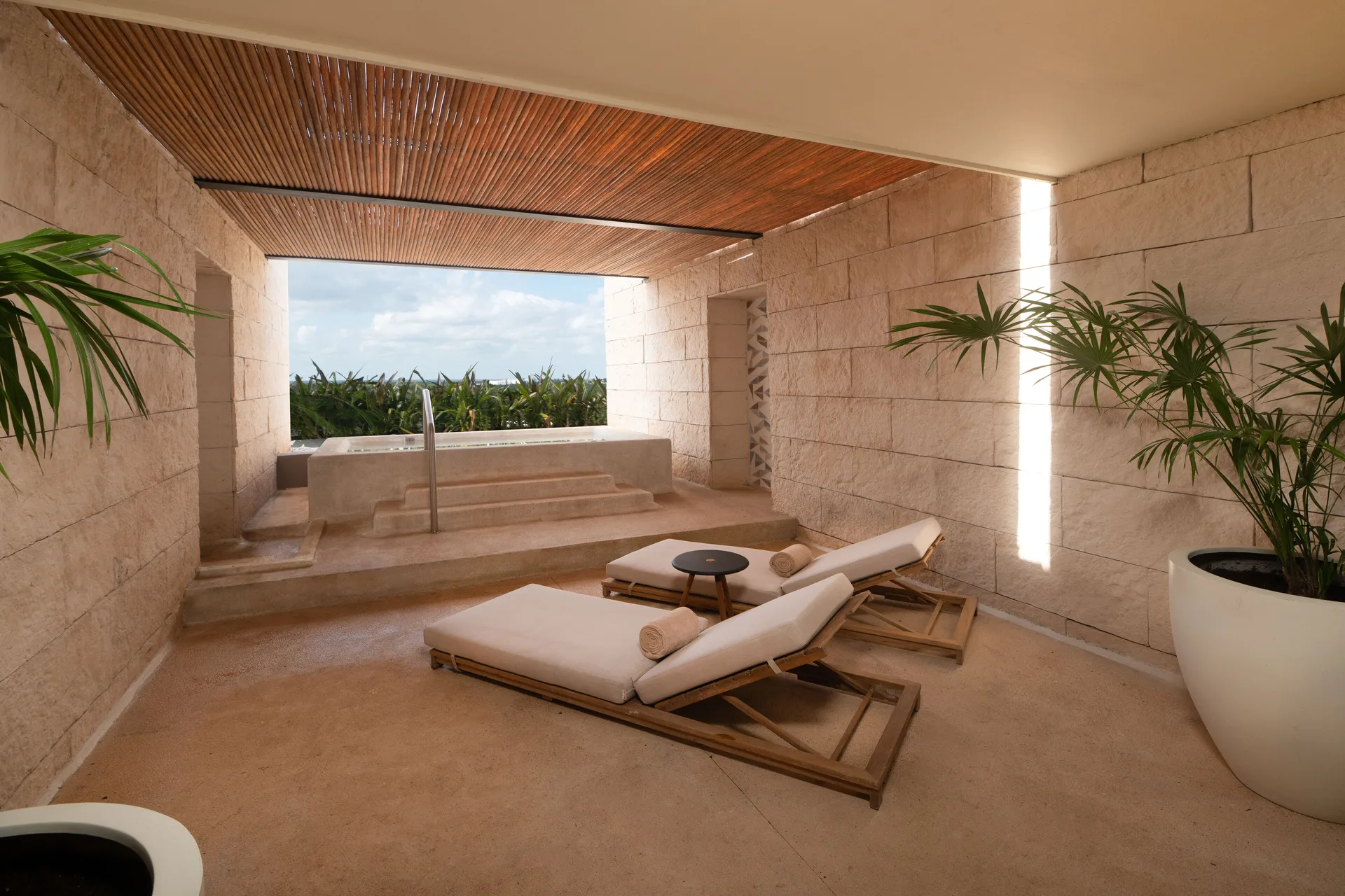 Inspira Terrace Suite private terrace with loungers and plunge pool at Atelier Playa Mujeres.