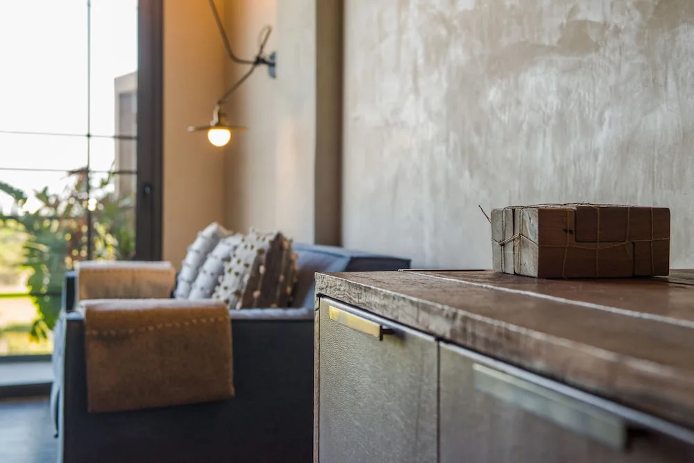 Sofa and cabinet detail in a Wheelchair Accessible Junior Suite at Atelier Playa Mujeres.