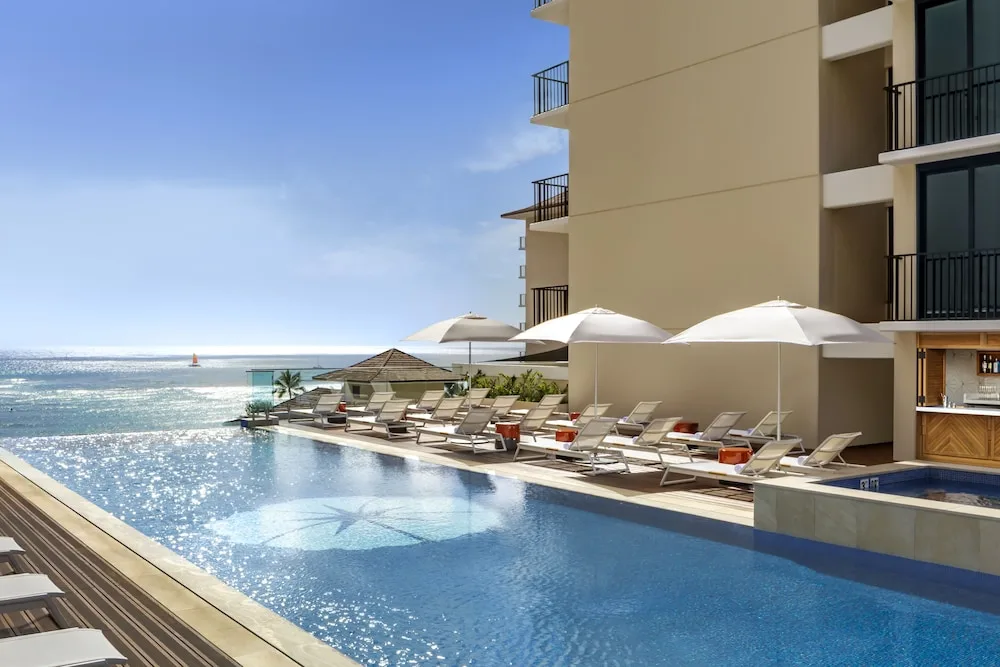 Halepuna Waikiki by Halekulani boutique hotel in Waikiki with modern design, rooftop pool, and proximity to shopping and dining.
