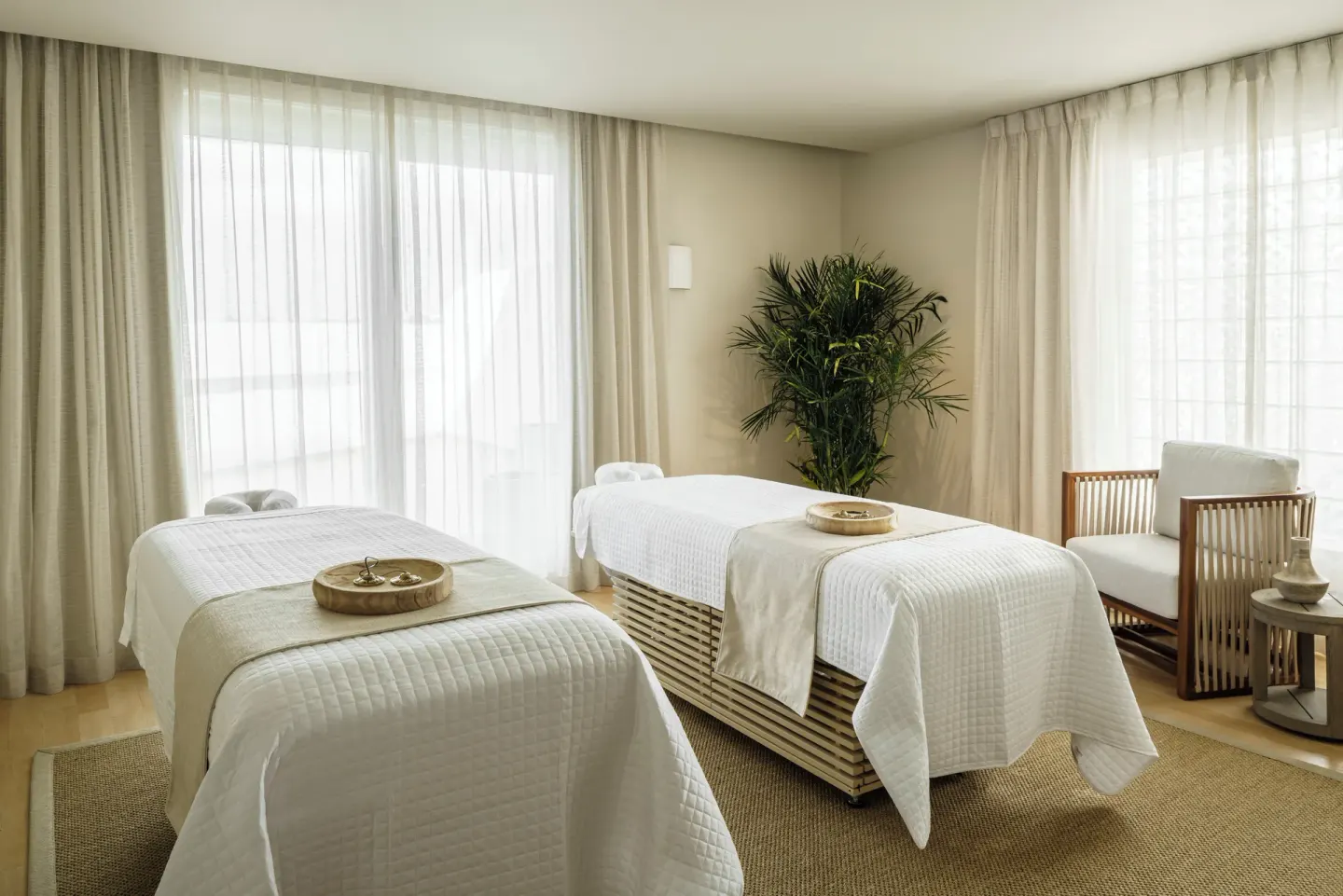 A double spa treatment room with two massage tables at Aurora Anguilla Resort & Golf Club.