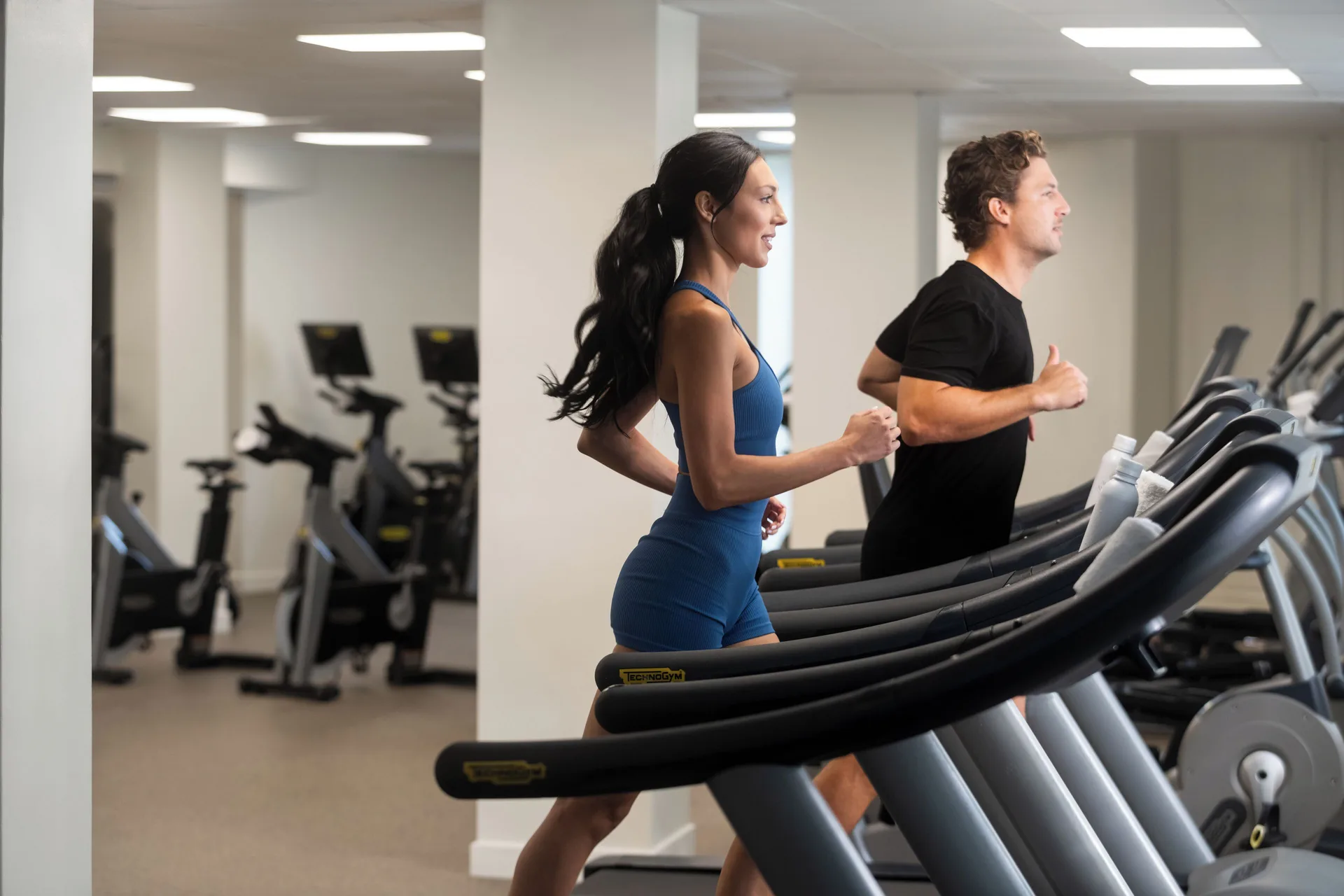 Guests run on treadmills in the fitness center at Aurora Anguilla Resort & Golf Club.