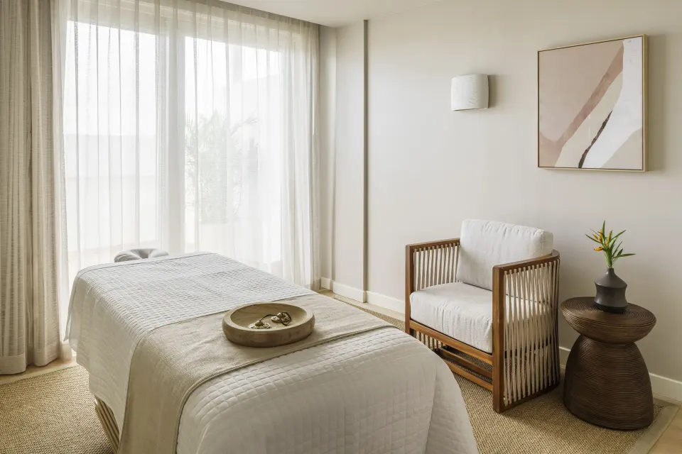 A single spa treatment room with a massage table at Aurora Anguilla Resort & Golf Club.