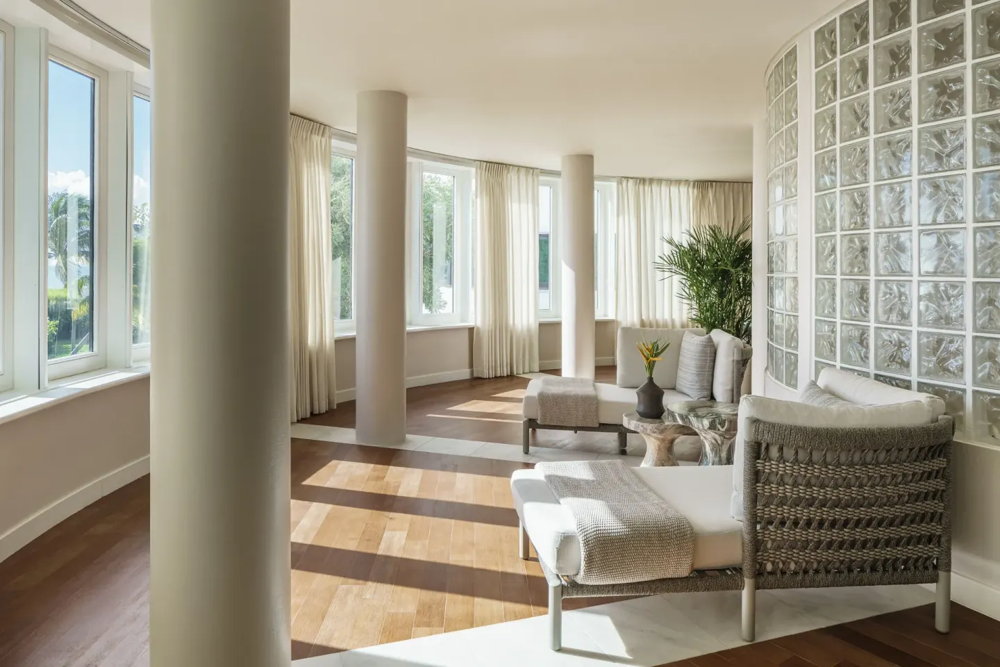 A bright spa lounge with curved windows at Aurora Anguilla Resort & Golf Club.
