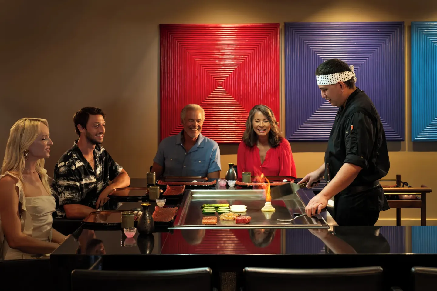 Teppanyaki chef cooking for guests at Aurora Anguilla Resort & Golf Club.