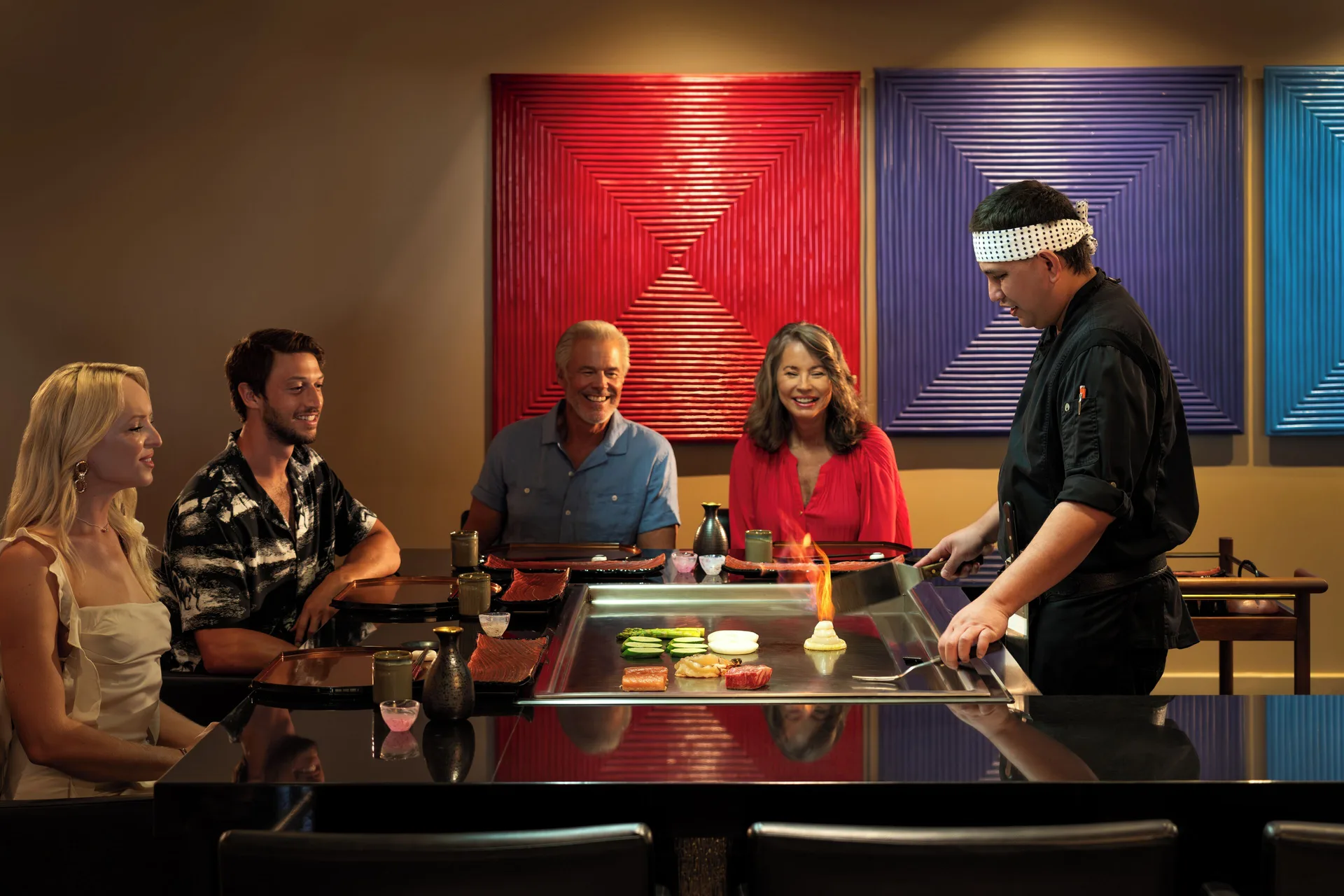 Teppanyaki chef cooking for guests at Aurora Anguilla Resort & Golf Club.